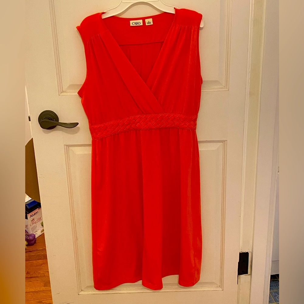 Bright orange dress.